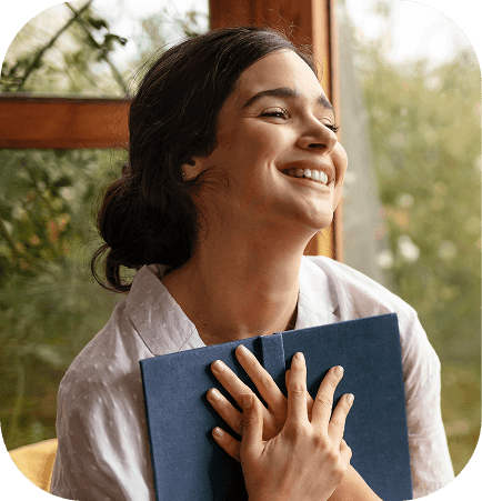 Woman experiencing wellness and relaxation with eyes closed