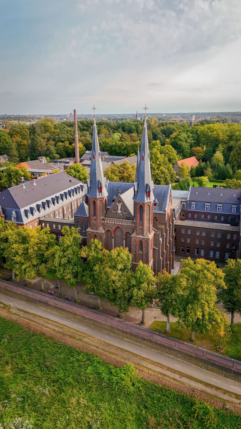 Aerial view of a European town with church spires.