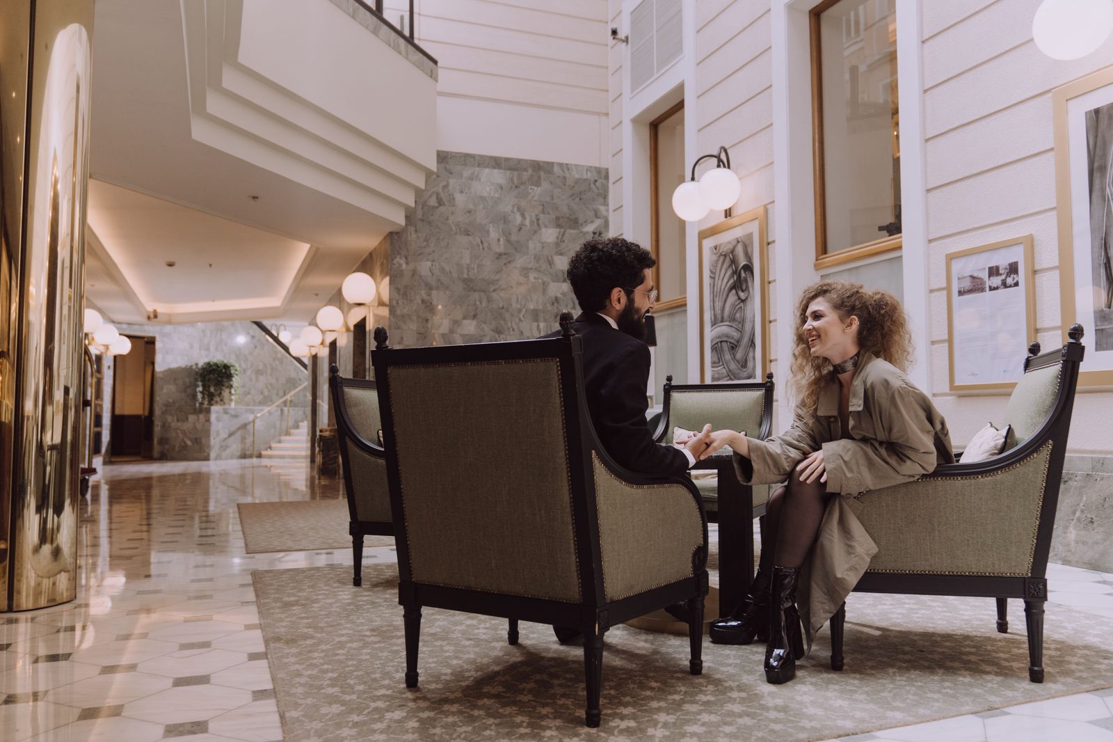 Guests relaxing in a premium hotel lounge.